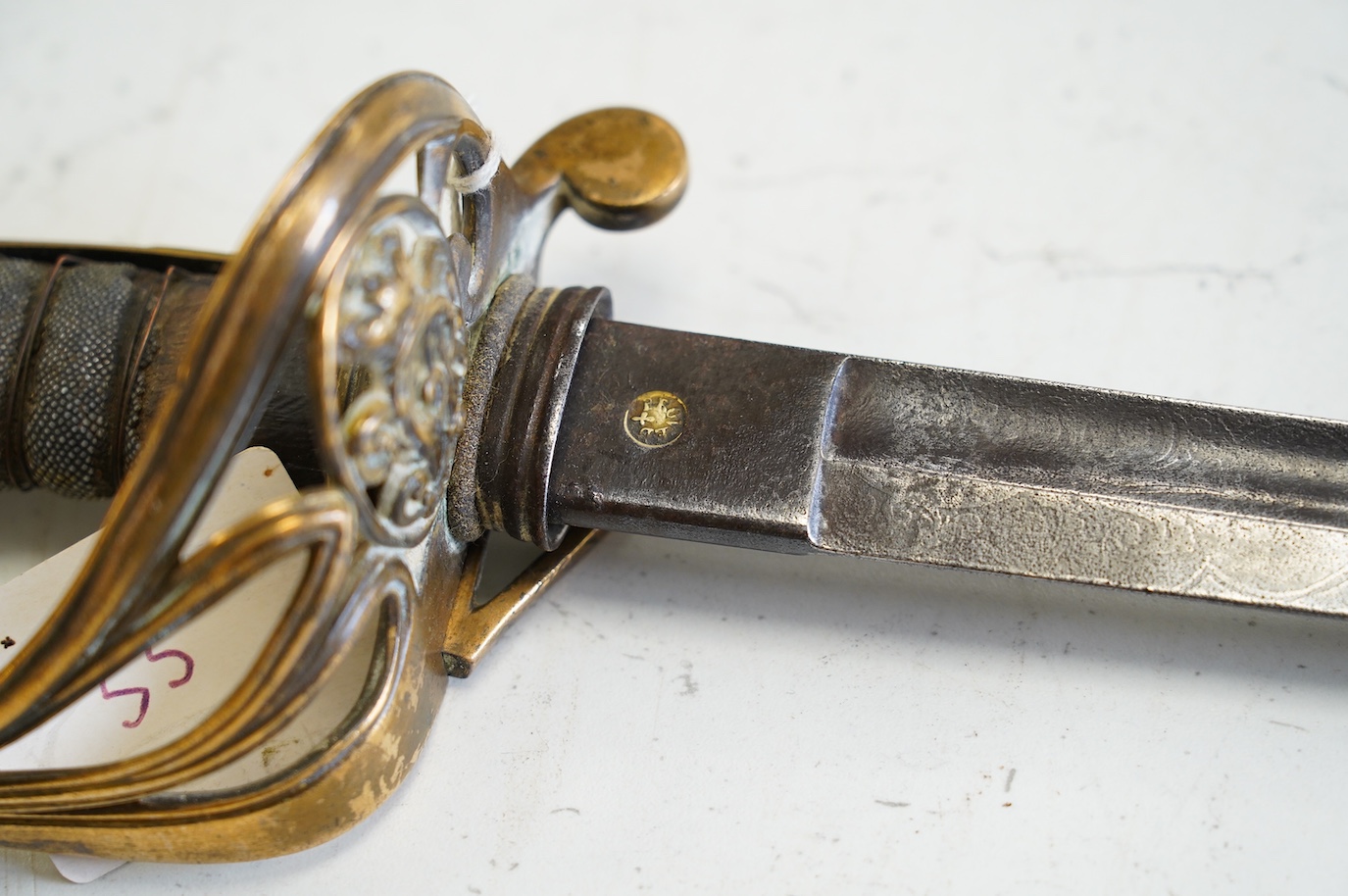 An 1845 infantry officer’s sword, with engraved, fullered and proofed blade, brass guard and remains of shagreen grip, blade 80.5cm. Condition - fair, well worn